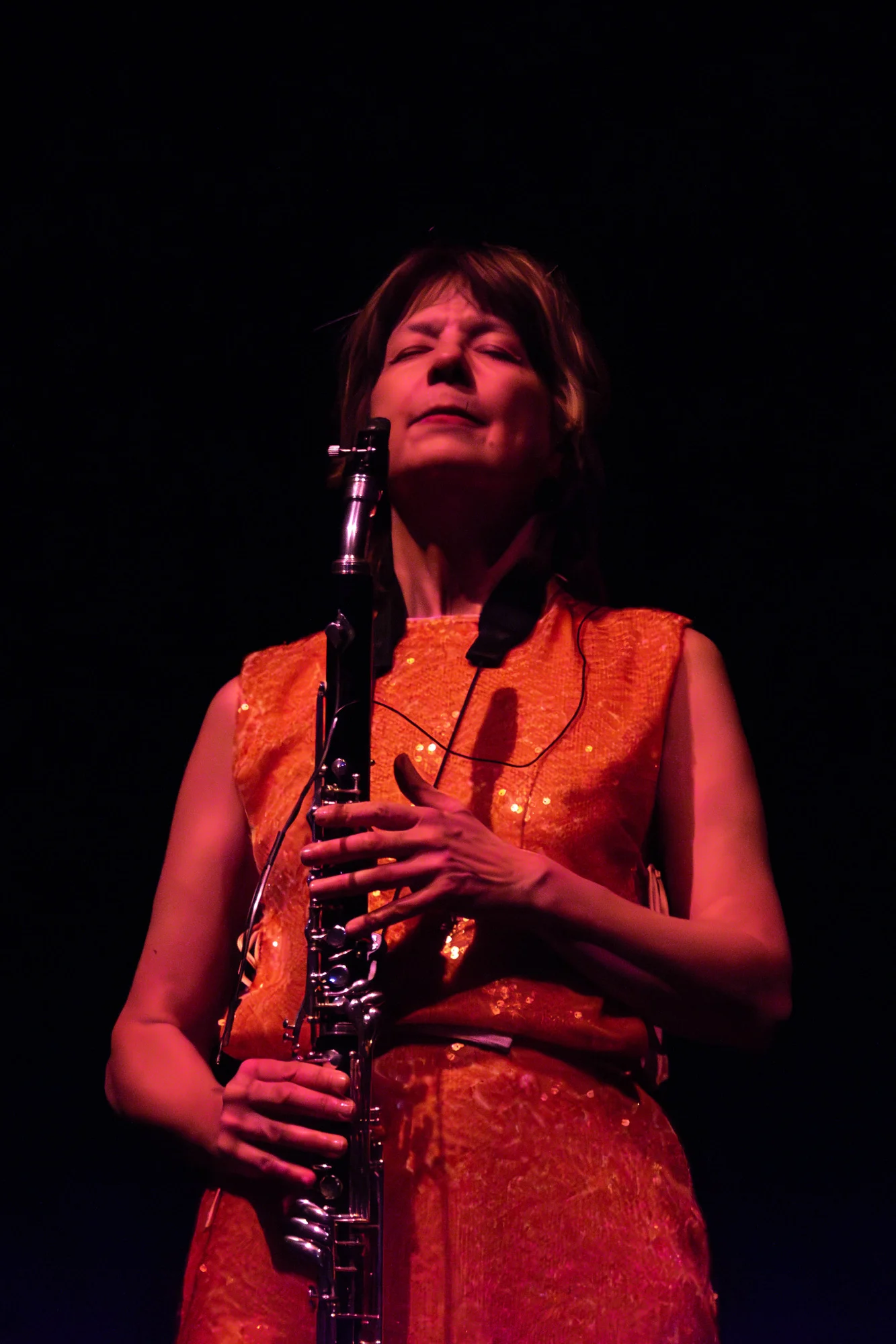 Basset horn performance in warm stage lighting